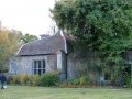 A restored Priory building beside the church.