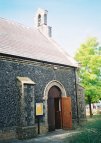 The north door, screened from the street.