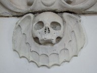 grinning winged skull