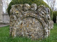 cherubs, skulls, foliage and floral wreath