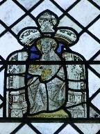 Saint holding a reliquary and book