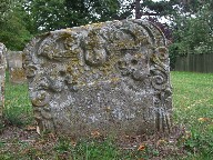 winged cherub and skulls