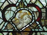 east window glass: crucified Christ (English medieval)
