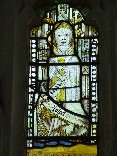 east window glass: eucharistic vestments
