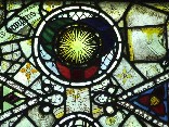 east window glass: sun